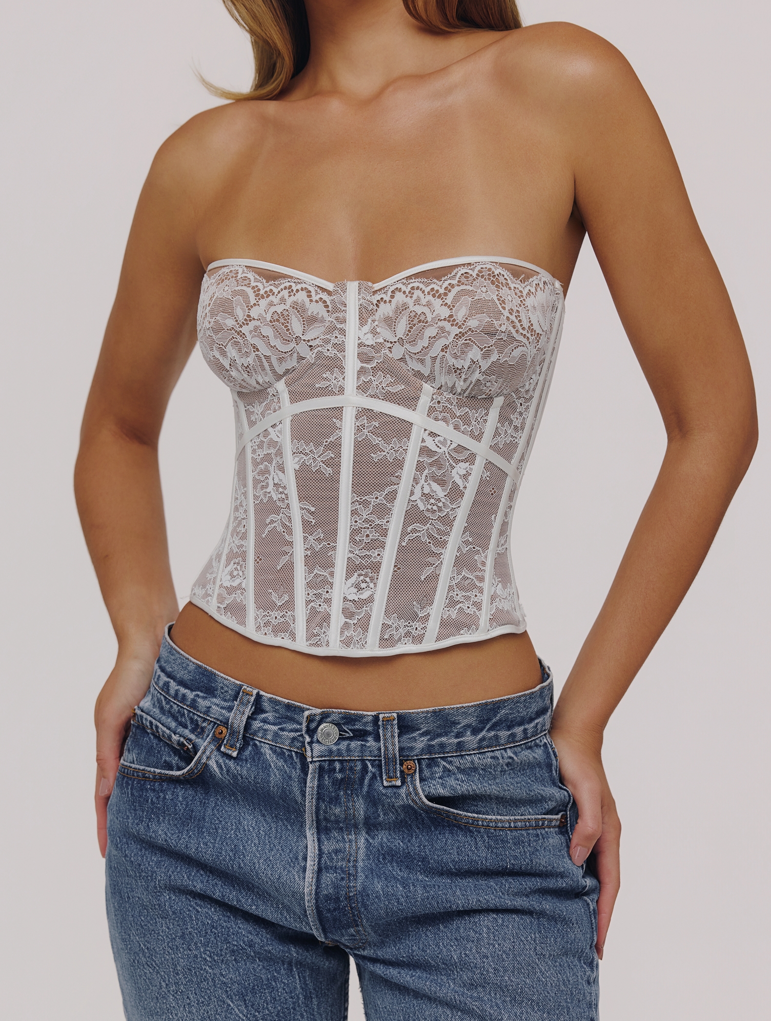 Frontal view of the  Ayana White Lace Boned Corset Top