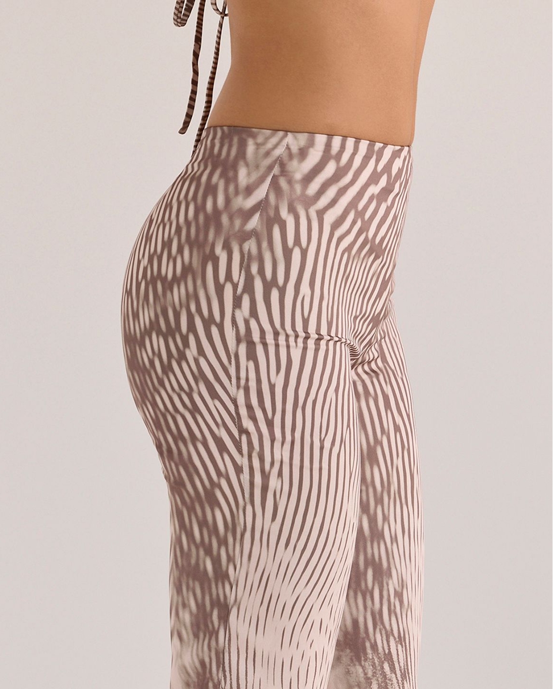 Close-up side view of the Maren Animal Print Satin Straight Leg Trousers